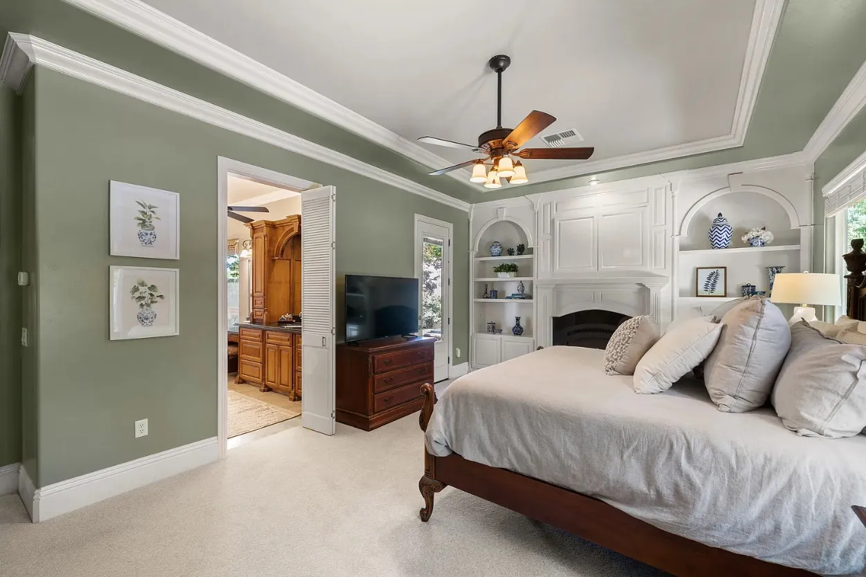 bedroom image with master bathroom in background