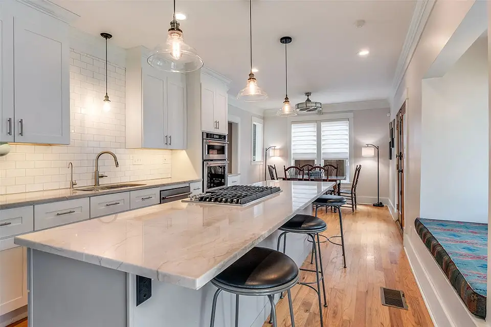 kitchen island with dining area in background