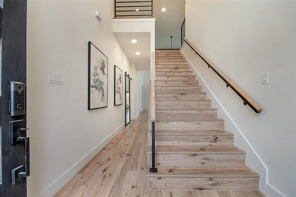 stairway on right with hallway on left