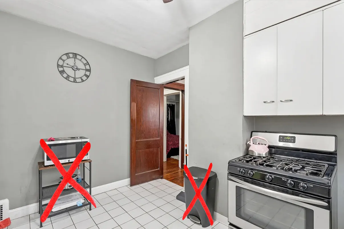 garbage can next to kitchen oven